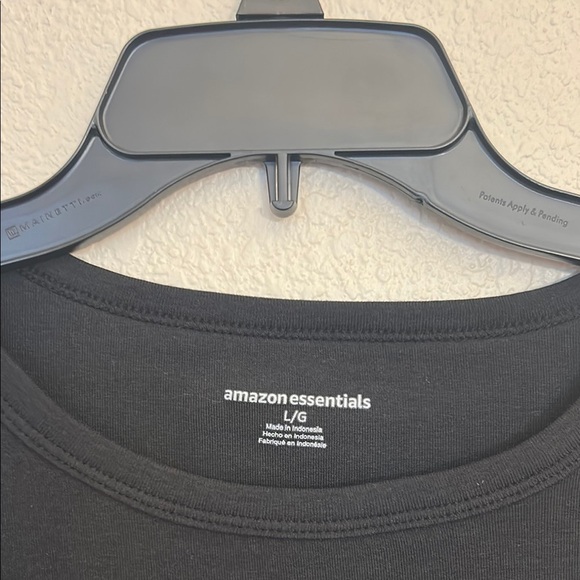 Women large Amazon tops in white and black. One top has a wider neckline. - Picture 8 of 14